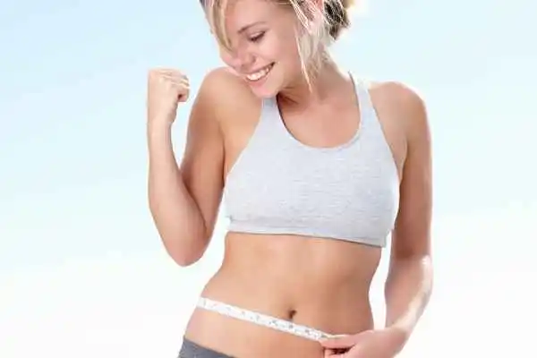 woman happy after fat reduction treatment Bury St Edmunds