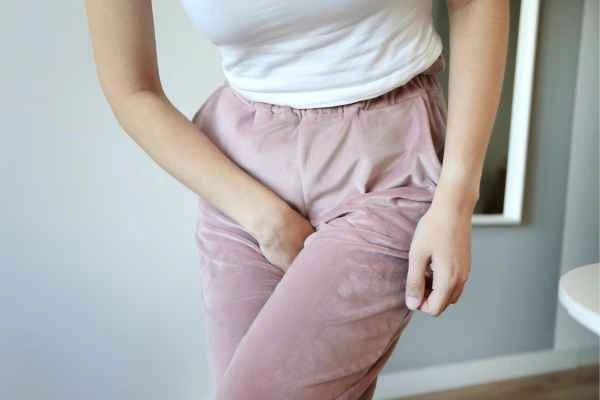 older woman running to the toilet because of urinary incontinence Bury St Edmunds